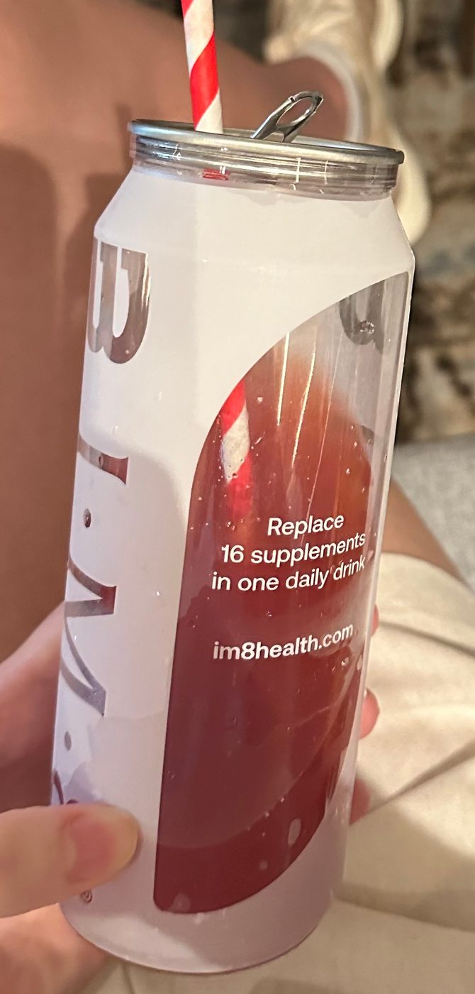 A can of IM8 that reads: Replace 16 supplements in one daily drink